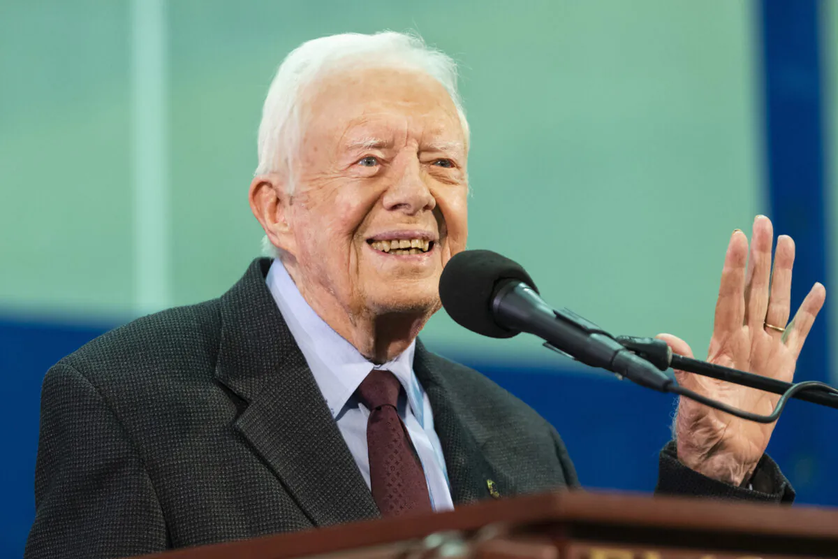 In this Sept. 18, 2019, file photo former President Jimmy Carter acknowledges a student who's question has been picked for him to answer during an annual Carter Town Hall held at Emory University in Atlanta. (AP Photo/John Amis, File)