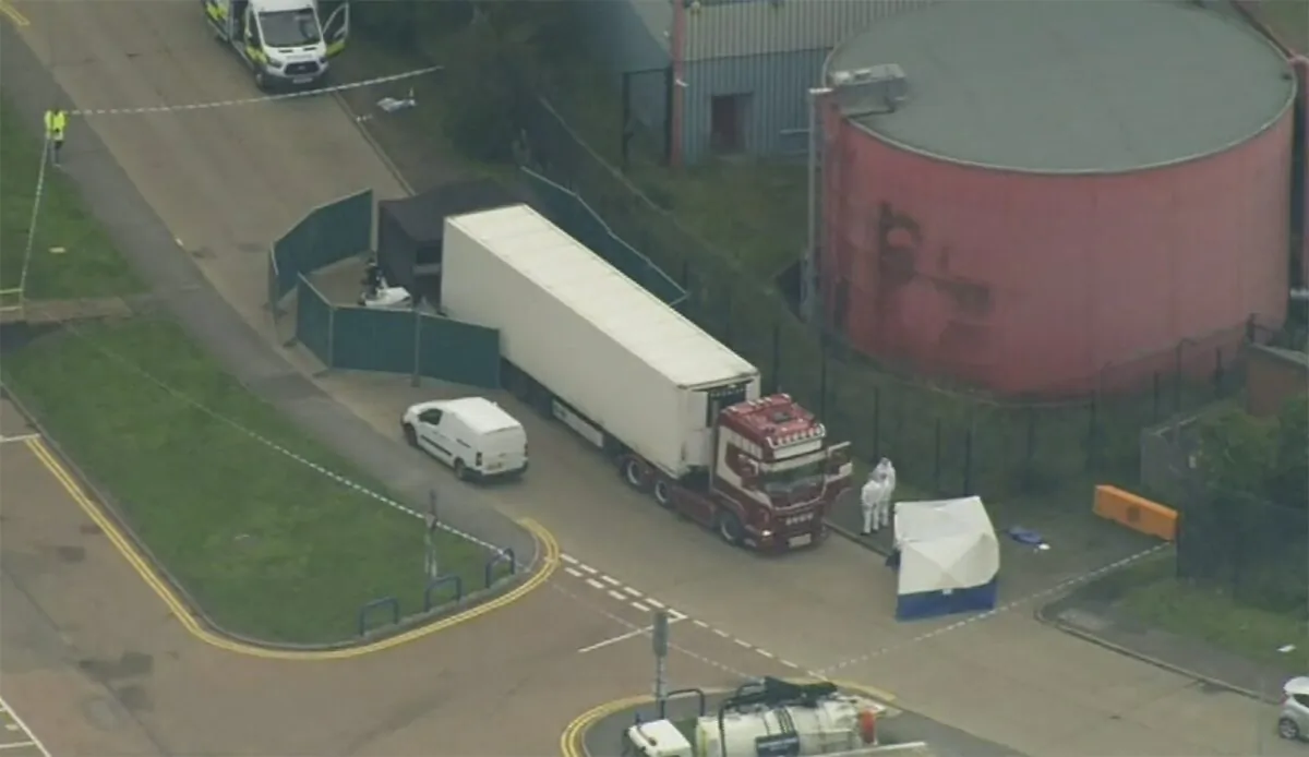 An aerial view as police forensic officers attend the scene after a truck was found to contain a large number of dead bodies, in Thurock, South England, early on Oct. 23, 2019. (UK Pool via AP)