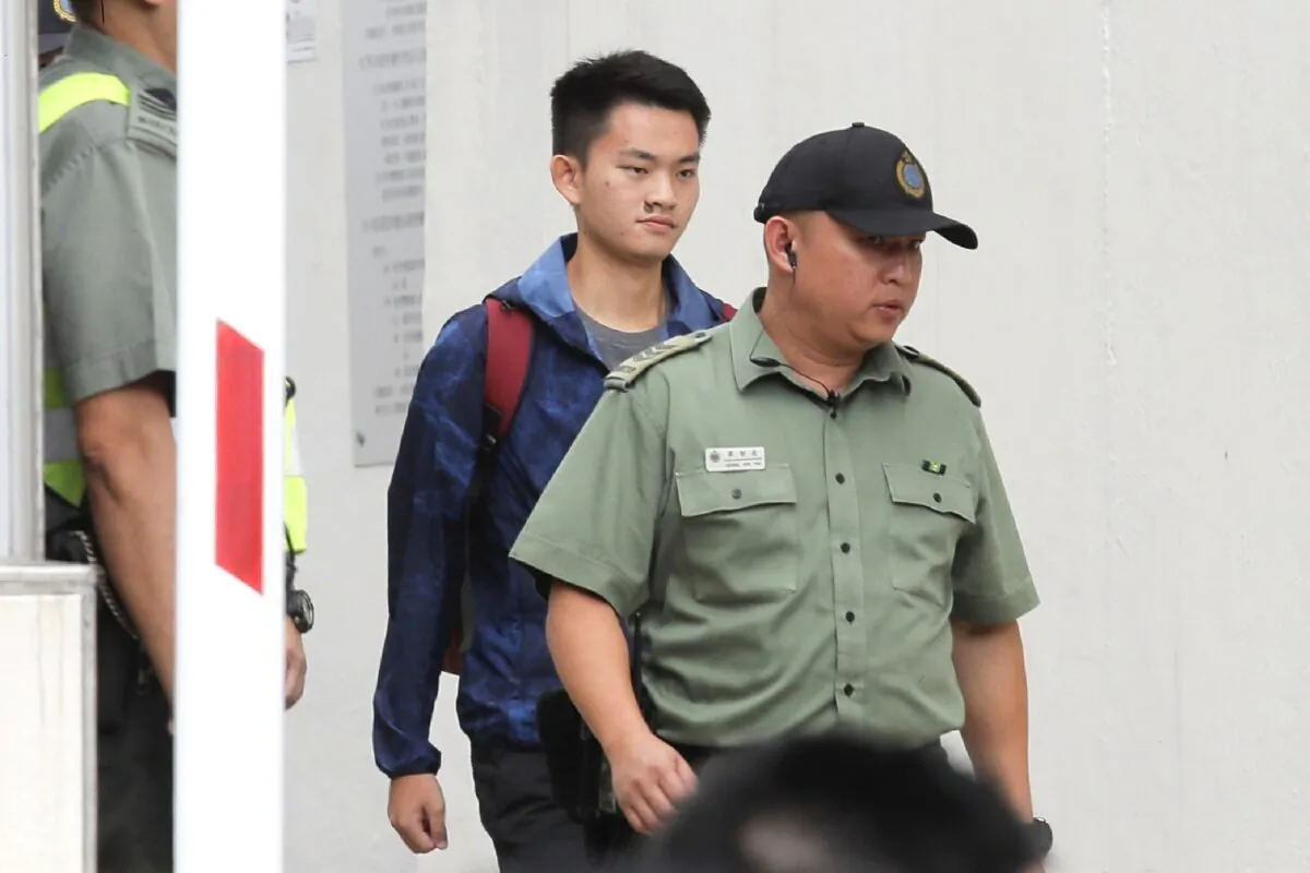 Chan Tong-kai (C), a Hong Kong citizen who was accused of murdering his girlfriend in Taiwan last year, walks as he is released from prison in Hong Kong on Oct. 23, 2019. (Kin Cheung/AP Photo)