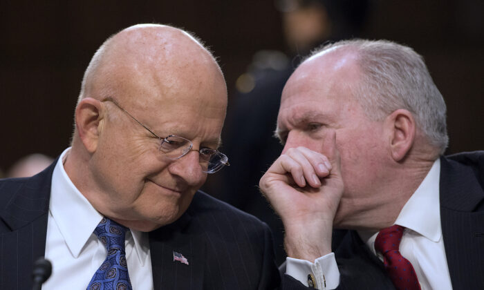Director of National Intelligence James Clapper (L) and CIA Director John Brennan chat before testifying before the Senate Intelligence Committee on Feb. 9, 2016. (MOLLY RILEY/AFP/Getty Images)