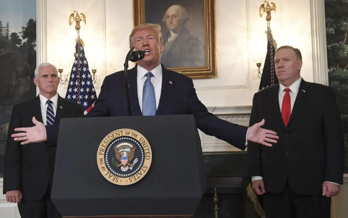 President Donald Trump speaks about Syria, next to US Vice President Mike Pence (L) and US Secretary of State Mike Pompeo in the Diplomatic Reception Room at the White House on Oct. 23, 2019. (Saul Loeb/AFP via Getty Images)