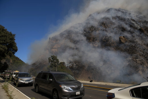 residents flee as a wildfire erupts