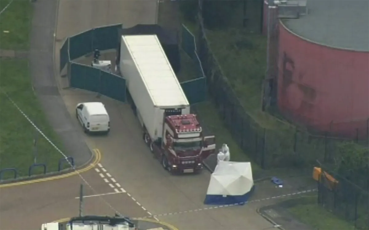 An aerial view as police forensic officers attend the scene after a truck was found to contain a large number of dead bodies in Thurrock, South England, on early Oct. 23, 2019. (UK Pool via AP)