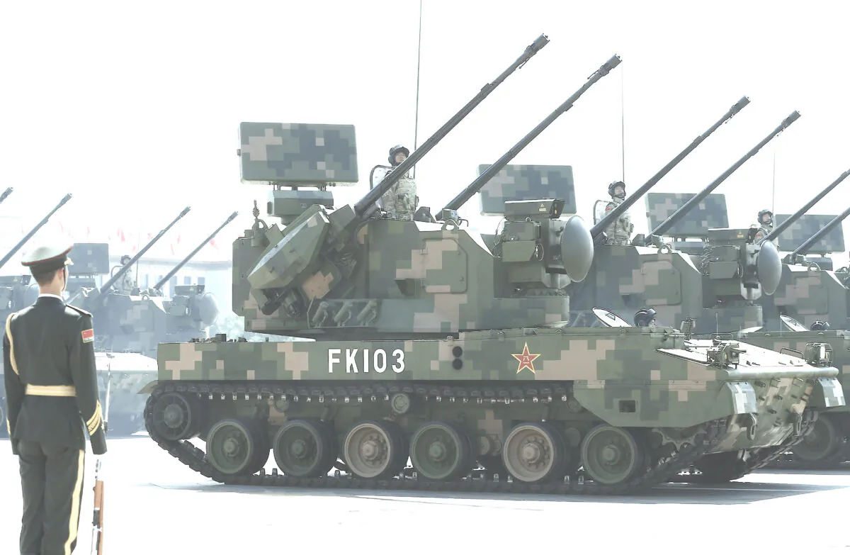 Military vehicles carrying missiles drive past the Tiananmen Gate during a military parade to mark the 70th anniversary of the end of World War Two in Beijing, China, on Sept. 3, 2015. (Rolex Dela Pena - Pool /Getty Images)