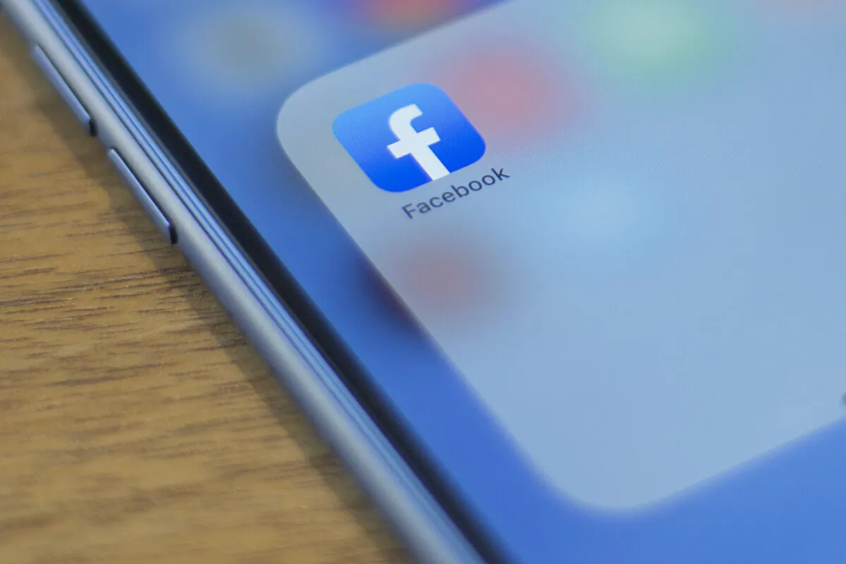The Facebook logo is seen on a phone in this photo illustration in Washington, on July 10, 2019. (Alastair Pike/AFP/Getty Images)