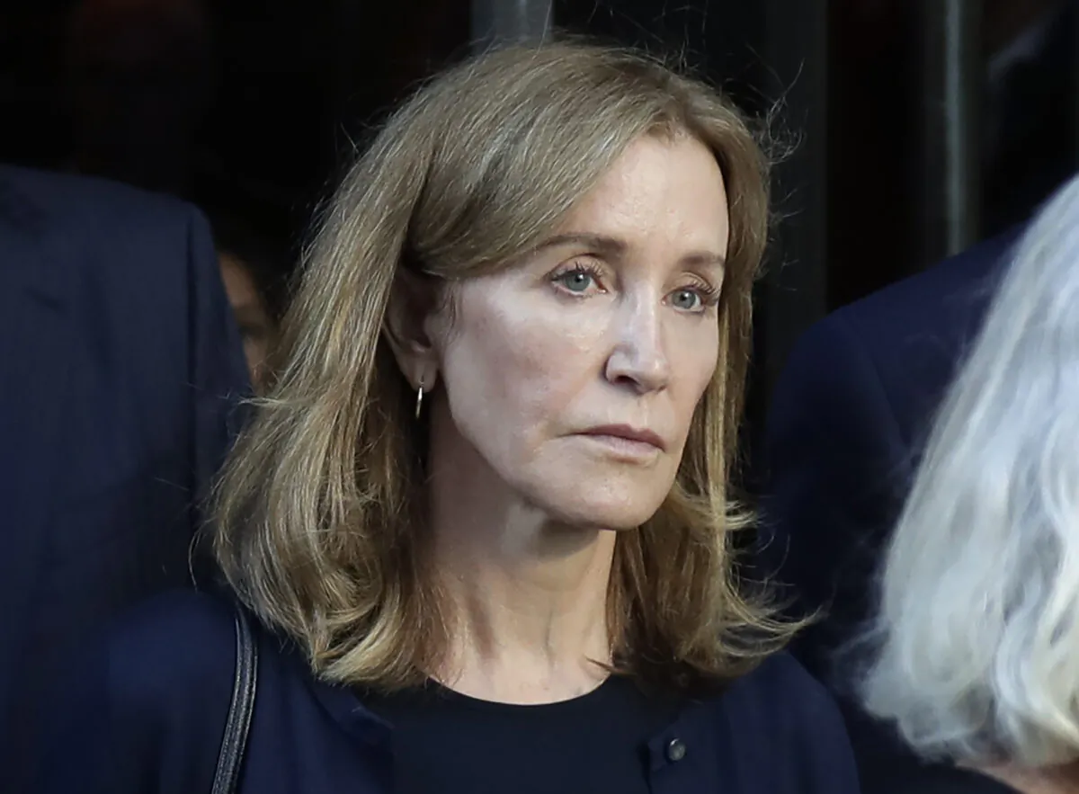 Actress Felicity Huffman leaving federal court after her sentencing in a nationwide college admissions bribery scandal in Boston on Sept. 13, 2019. (AP Photo/Elise Amendola, File)