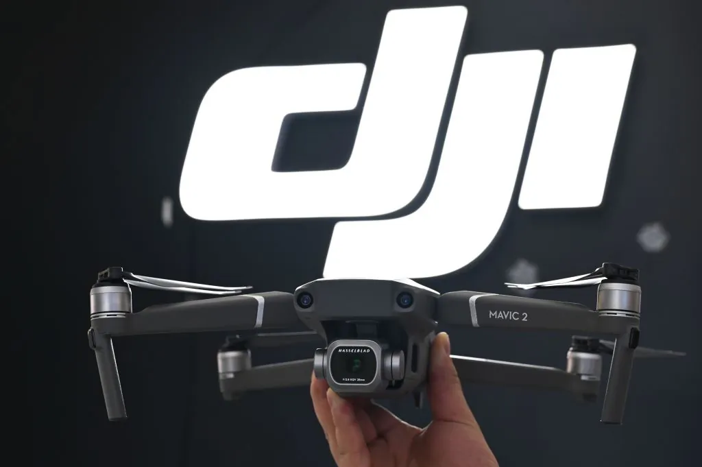 An employee shows the new Mavic 2 Pro drone in a DJI store in Shanghai on May 22, 2019. (Hector Retamal/AFP/Getty Images)