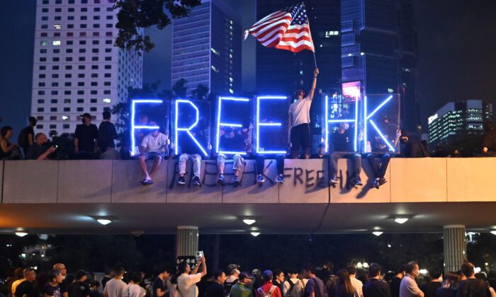 A light installation that reads "Free HK" is seen as people take part in a rally of healthcare professionals in Hong Kong's Central district on Oct. 26, 2019. (Philip Fong/AFP via Getty Images)