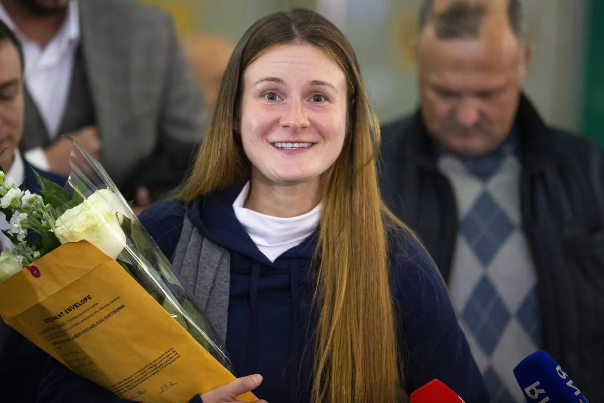 Russian agent Maria Butina smiles as she speaks to journalists upon her arrival from the United States at Moscow International Airport Sheremetyevo outside Moscow on Oct. 26, 2019. (AP Photo/Alexander Zemlianichenko)