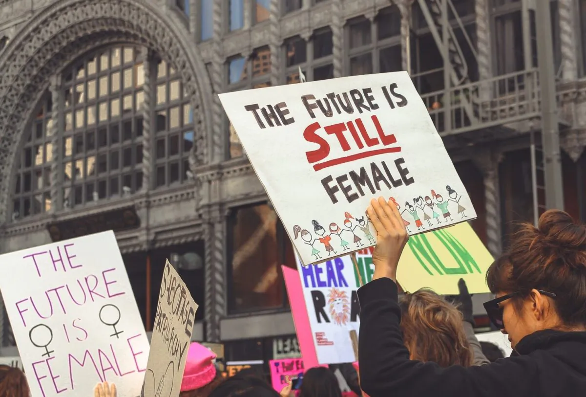 Participants in the Women's March 2018 hold signs saying "The Future is Female." Men and traditional masculinity are under attack, concludes Nicole Russell, after reading GQ's latest issue on masculinity. (Miawicks9/Pixabay)