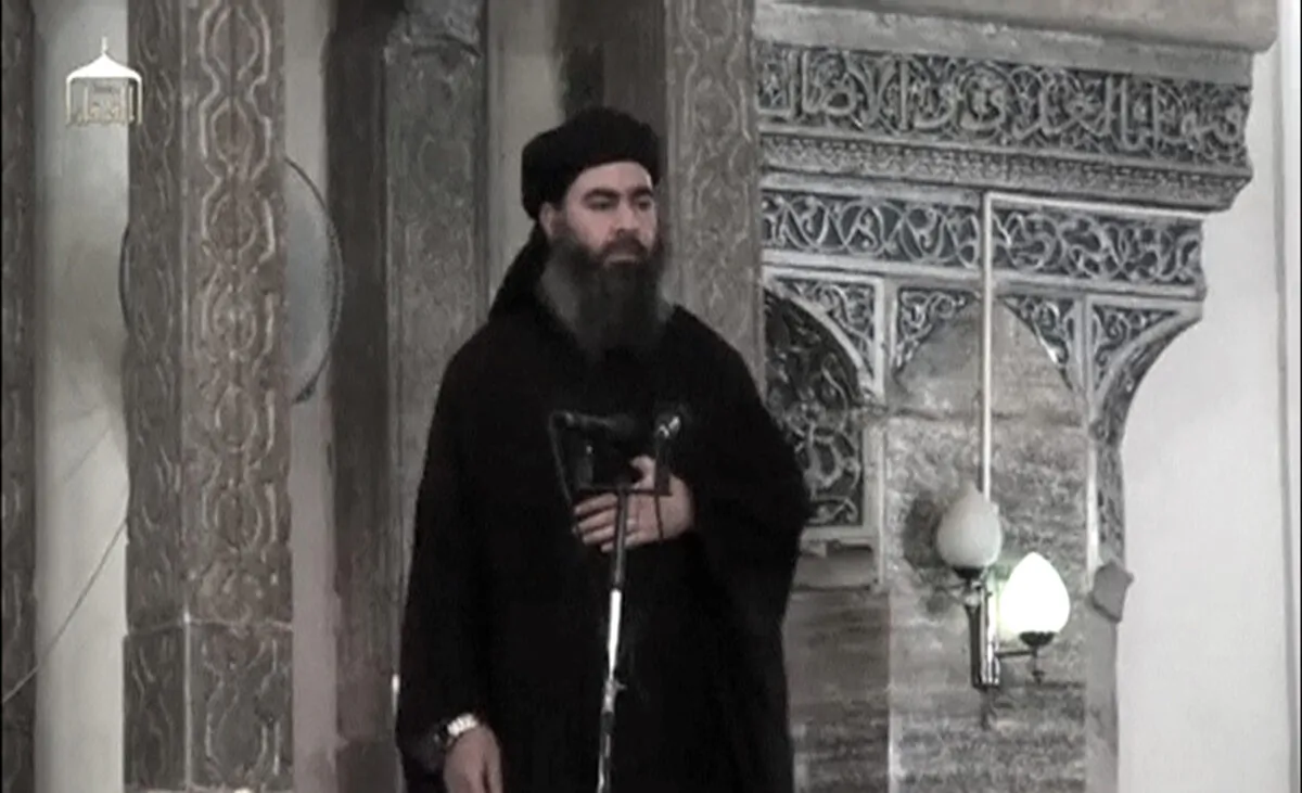 The deceased leader of the ISIS terrorist group, Abu Bakr al-Baghdadi, at a mosque in Iraq on July 5, 2014. (Extremist video/AP Photo)