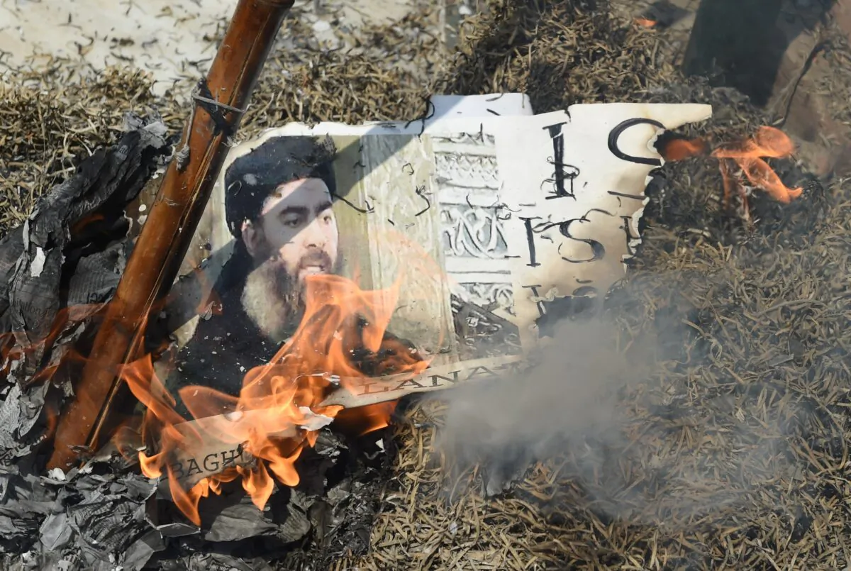 Demonstrators burn an effigy of the ISIS leader Abu Bakr al-Baghdadi during a protest in New Delhi on June 9, 2017. (Prakash Singh/AFP/Getty Images)