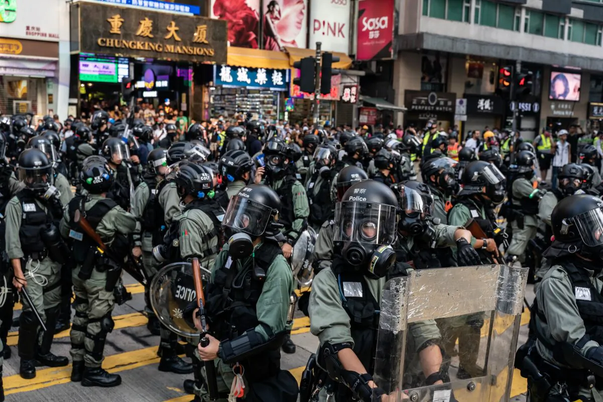 Riot police stand guard on a street outside of Chung King Mansions in Tsim Sha Tsui district in Hong Kong, China on October 27, 2019. (Anthony Kwan/Getty Images)