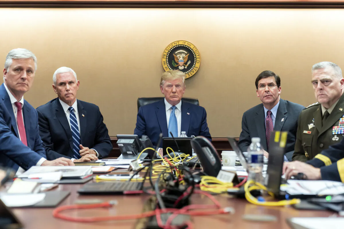 In this image released by the White House, President Donald Trump is joined by Vice President Mike Pence, second from left, national security adviser Robert O’Brien, left; Secretary of Defense Mark Esper, second from right, and Chairman of the Joint Chiefs of Staff Army Gen. Mark A. Milley, right, Saturday, Oct. 26, 2019, in the Situation Room of the White House monitoring developments in the U.S. Special Operations forces raid that took out Islamic State leader Abu Bakr al-Baghdadi. (Shealah Craighead/White House via AP)