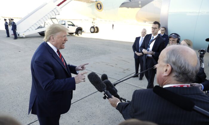 President Donald Trump talks to reporters before boarding Air Force One for a trip to Chicago to attend the International Association of Chiefs of Police Annual Conference and Exposition on Oct. 28, 2019, at  Andrews Air Force Base, Md. (AP Photo/Evan Vucci)