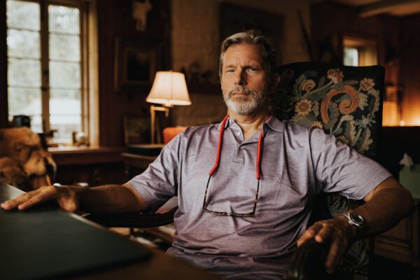 Warner IV at his desk