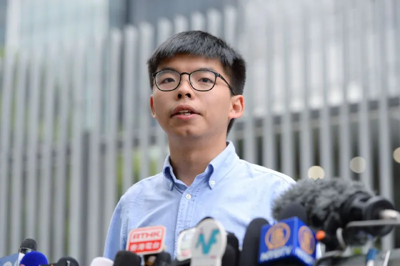 Pro-democracy activist Joshua Wong speaks to the media outside the Legislative Council in Hong Kong on Oct. 29, 2019. (Sung Pi Lung/The Epoch Times) 