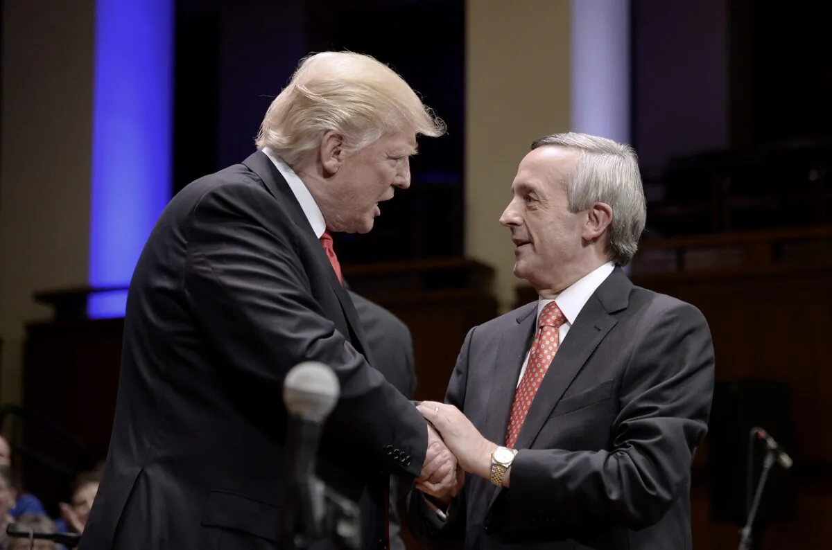 President Donald Trump greets Pastor Robert Jeffress at the John F. Kennedy Center for the Performing Arts in Washington on July 1, 2017.  (Olivier Douliery-Pool via Getty Images)