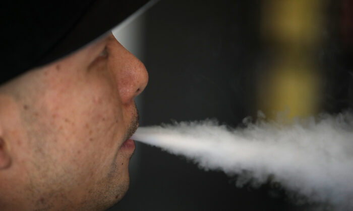 A man blows vapor from an e-cigarette in South San Francisco, Calif., on Jan. 23, 2018. (Justin Sullivan/Getty Images)