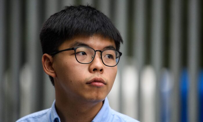 Pro-democracy activist Joshua Wong speaks to the media outside the Legislative Council (LegCo) in Hong Kong on Oct. 29, 2019. (Anthony Wallace/AFP via Getty Images)
