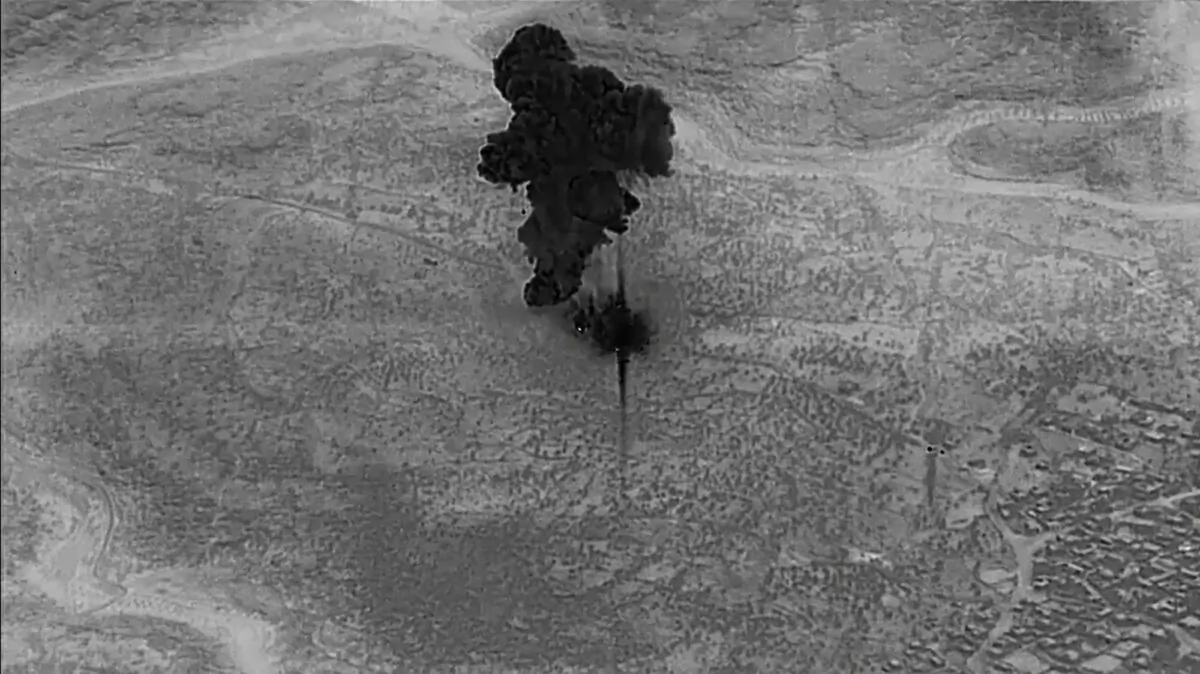 A smoke cloud rises moments after an air strike on the compound of ISIS terrorist group leader Abu Bakr al-Baghdadi, in the Idlib region of Syria, on Oct. 26, 2019. (Department of Defense/Reuters)