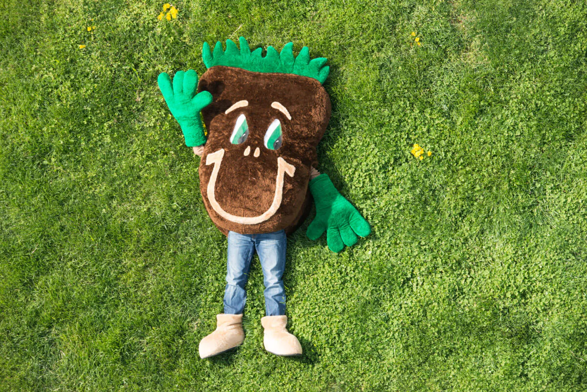 The U.S. Department of Agriculture’s Natural Resources Conservation Service mascot Sammy Soil lays on a cover crop of wheat in a field on Sunny Ridge Farm in Laytonsville, MD, on April 28, 2014. (USDA Photo by Lance Cheung)