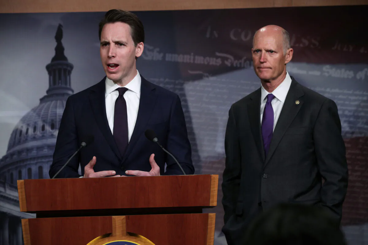 U.S. Sen. Josh Hawley (R-MO) (L) and Sen. Rick Scott (R-FL) (R) listens during a news conference at the U.S. Capitol in Washington, on April 2, 2019. (Alex Wong/Getty Images)