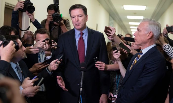Former FBI Director James Comey (C) talks to reporters following a closed House Judiciary Committee meeting to hear his testimony, on Capitol Hill in Washington on Dec. 7, 2018. (Alex Edelman/AFP/Getty Images)