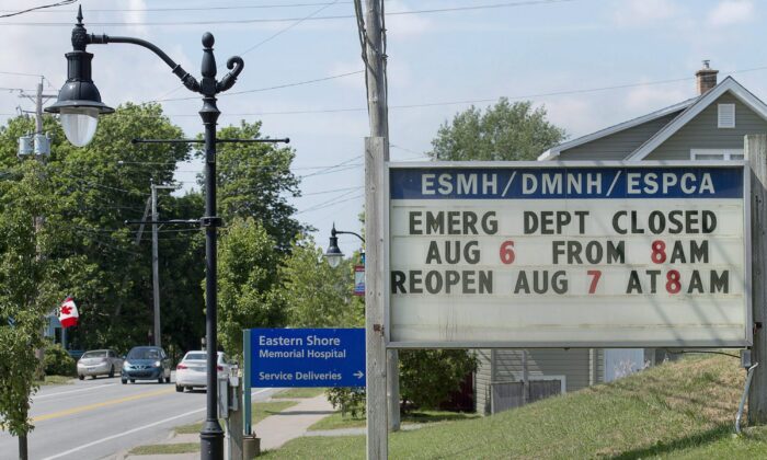 A sign shows the times of temporary emergency department closures at Eastern Shore Memorial Hospital in Sheet Harbour, N.S., on Aug. 6, 2018. (THE CANADIAN PRESS/Andrew Vaughan)
