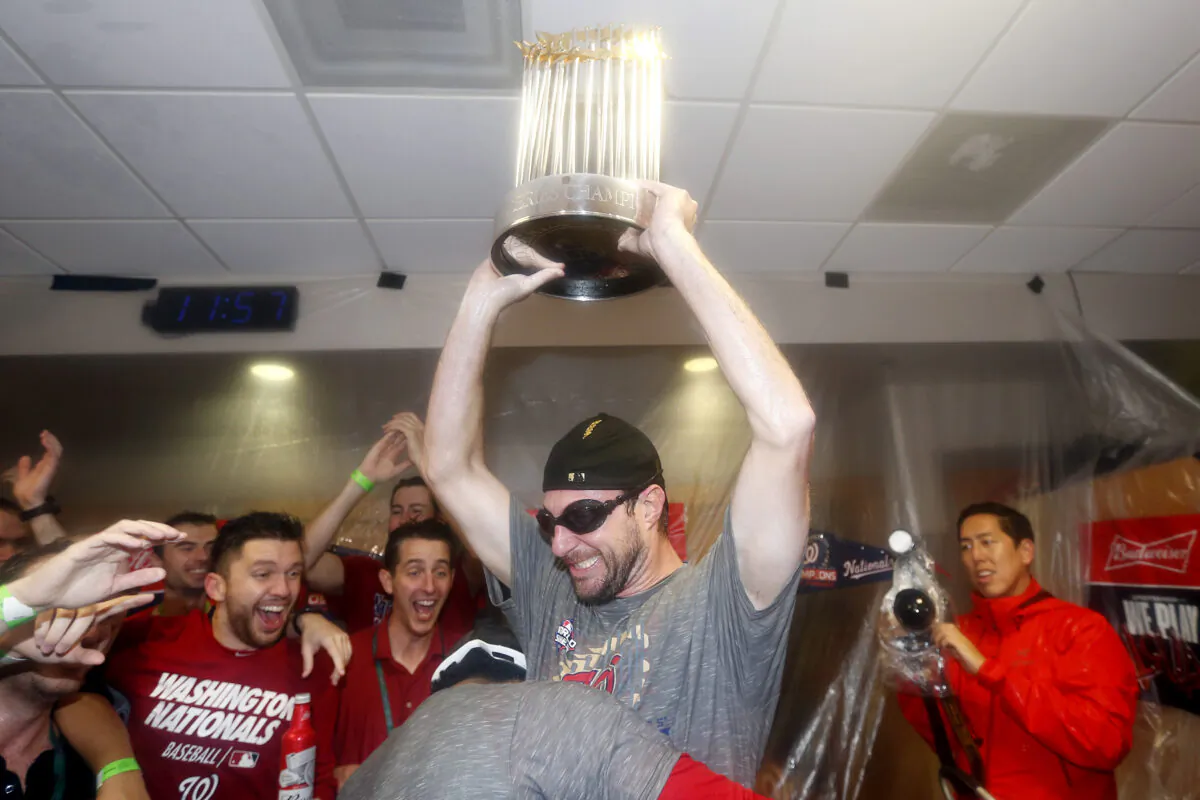 Max Scherzer #31 of the Washington Nationals celebrates in the locker room after defeating the Houston Astros in Game Seven to win the 2019 World Series at Minute Maid Park in Houston, Texas on Oct. 30, 2019. (Elsa/Getty Images)