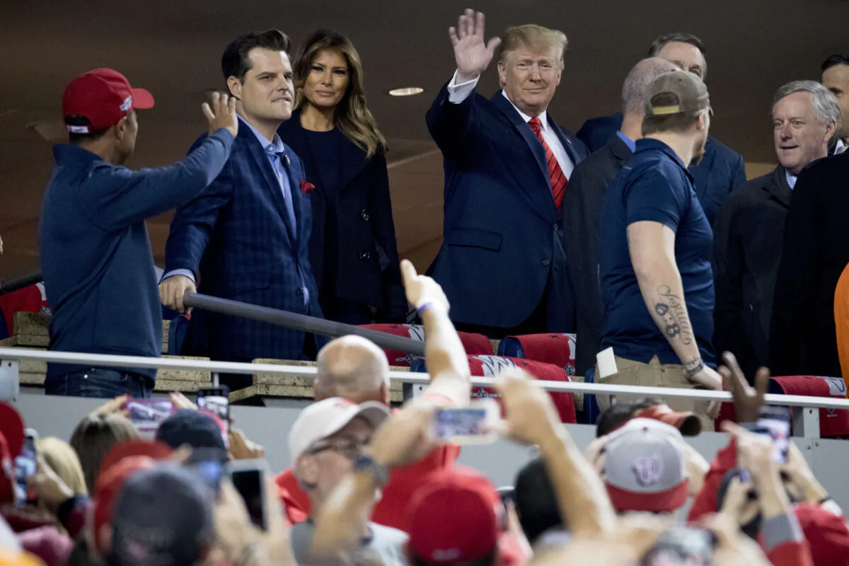 President Donald Trump and first lady Melania Trump, third from left, arrive for Game 5 of the World Series baseball game between the Houston Astros and the Washington Nationals at Nationals Park in Washington on Oct. 27, 2019. Also pictured are Rep. Matt Gaetz R(-Fla.) second from left, and Rep. Mark Meadows (R-N.C) right. (AP Photo/Andrew Harnik)