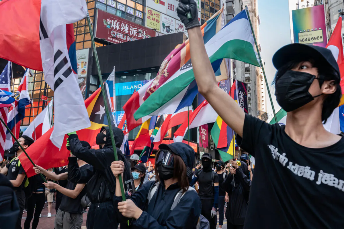 Pro-democracy protesters waves flags as they take part in a demonstration in Hong Kong, on Nov. 2, 2019. (Anthony Kwan/Getty Images)