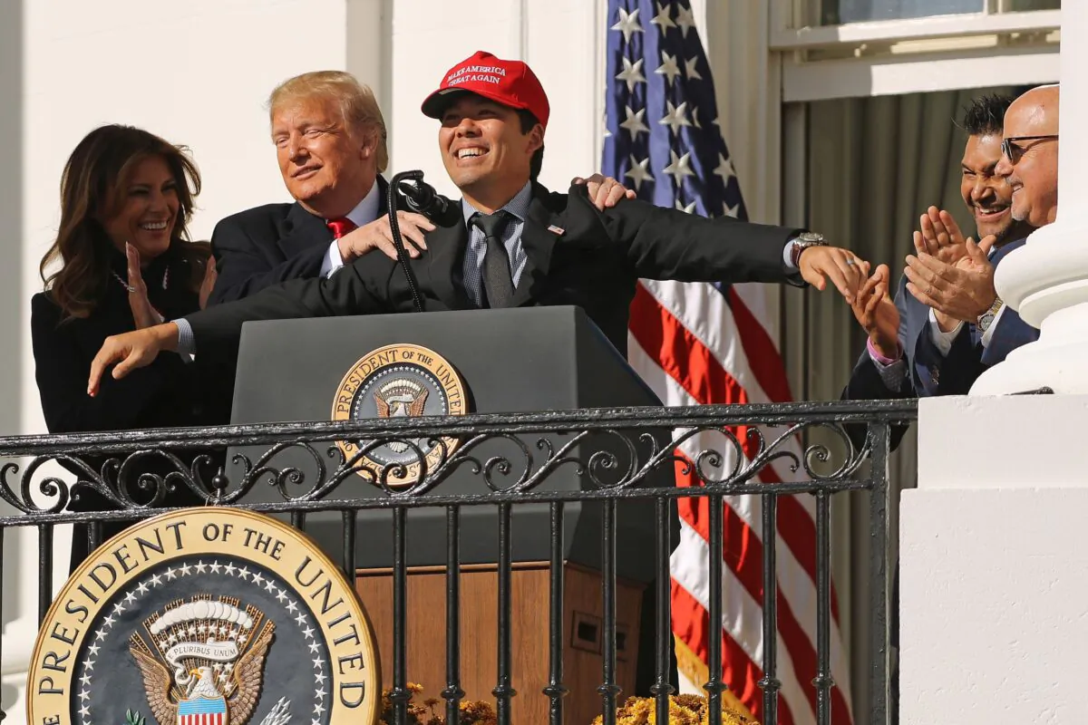 President Donald Trump reacts to Washington National catcher Kurt Suzuki wearing a 'Make America Great Again' cap during a celebration of the 2019 World Series Champions at the White House on Nov. 4, 2019. (Chip Somodevilla/Getty Images)