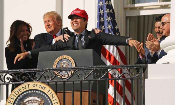 President Donald Trump reacts to Washington National catcher Kurt Suzuki wearing a 'Make America Great Again' cap during a celebration of the 2019 World Series Champions at the White House on Nov. 4, 2019. (Chip Somodevilla/Getty Images)