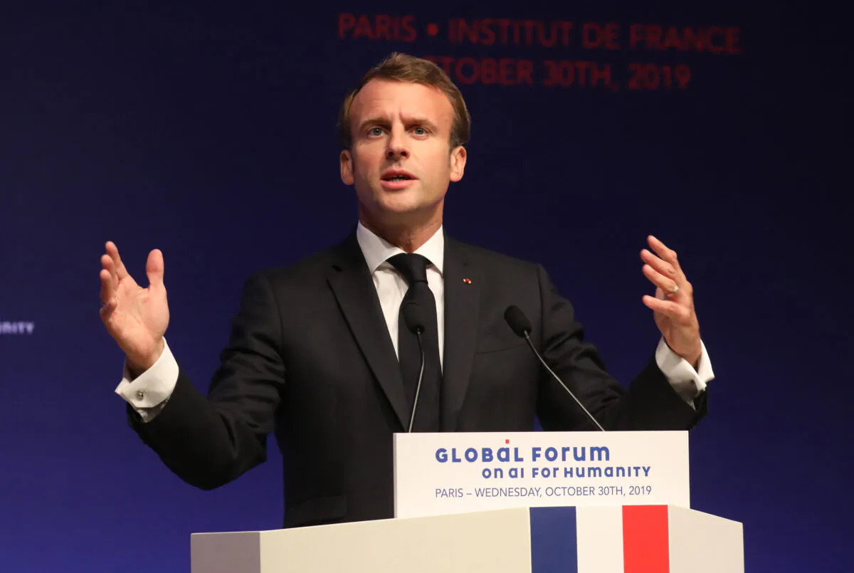 French President Emmanuel Macron delivers a speech during the Global forum on Artificial Intelligence (AI) for Humanity (GFAIH) at the Institut de France in Paris on Oct. 30, 2019. Macron is visiting China amid a push for Beijing to open its markets, despite festering trade disputes and weakened consumer spending. (Ludovic Marin/Pool via AP)