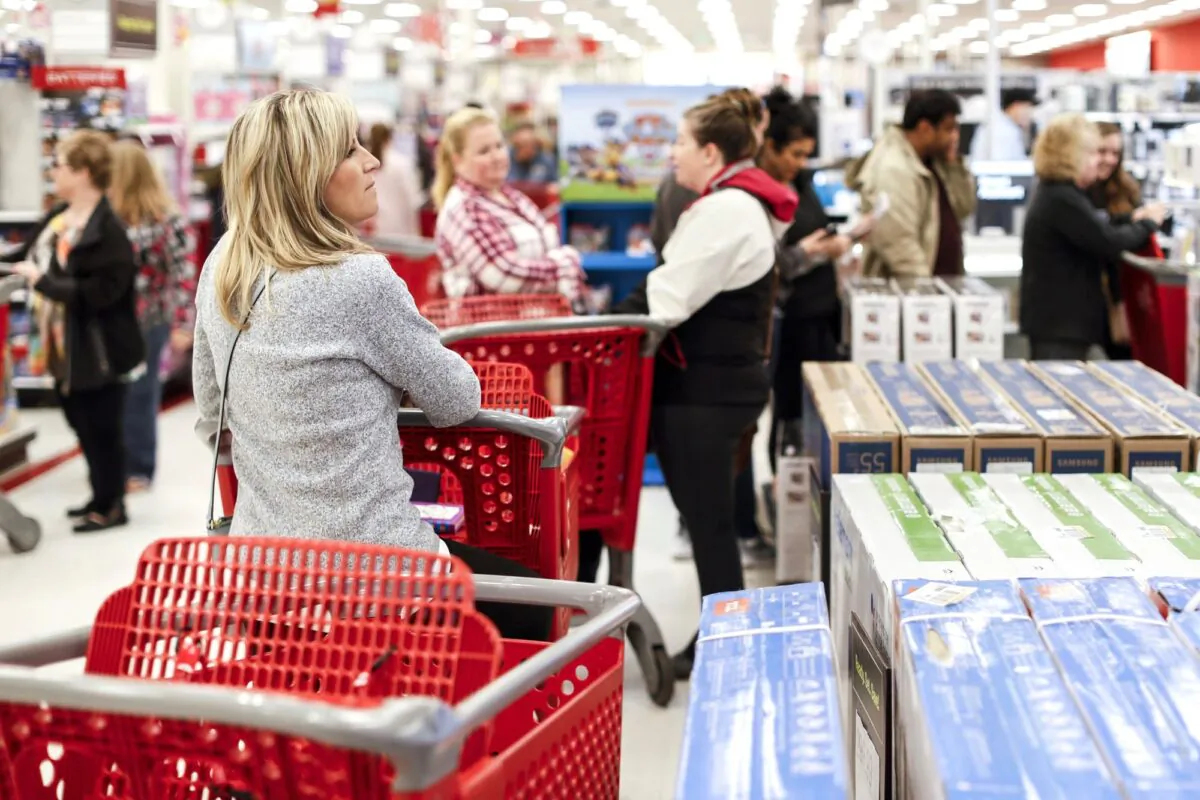 Shoppers wait in line for Apple iPhone purchases during a Black Friday sale at a Target store in Newport, Ky., on Nov. 23, 2018. (John Minchillo/AP Photo)
