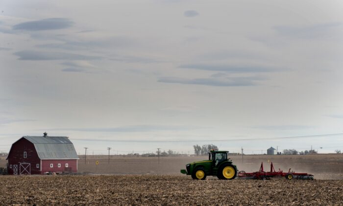 A farmer plows his fields in the small northeastern agricultural town of Eaton, Colorado, on Feb. 10, 2017. 
With a population of just over 5,000 residents, 71% of the town's registered voters cast their ballots in support of President Donald Trump during the 2016 U.S. presidential election. (Jason Connolly/AFP via Getty Images)