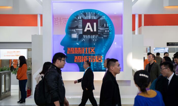 Visitors walk past a stand with artificial intelligence security cameras using facial recognition technology at the 14th China International Exhibition on Public Safety and Security in Beijing on Oct. 24, 2018. (Nicolas Asfouri/AFP via Getty Images)