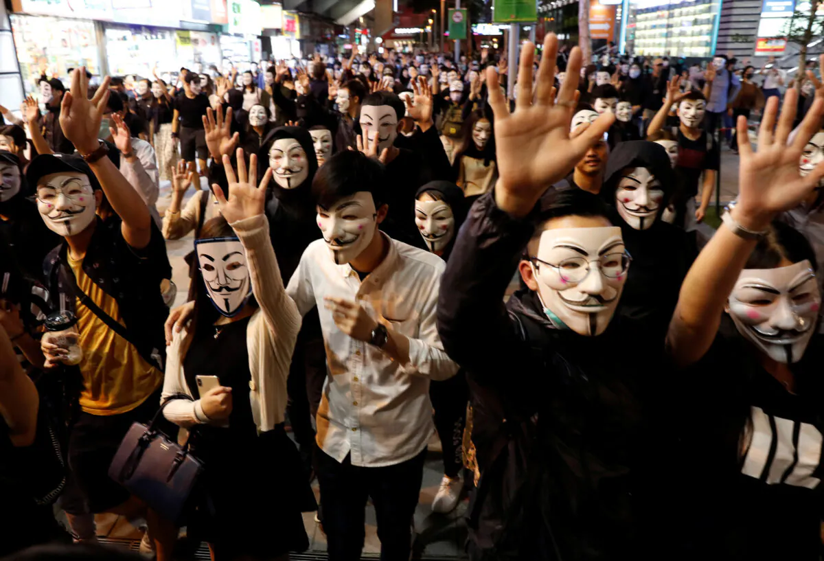 Protesters wearing Guy Fawkes masks attend an anti-government demonstration in Hong Kong, China on Nov. 5, 2019. (Kim Kyung-Hoon/Reuters)