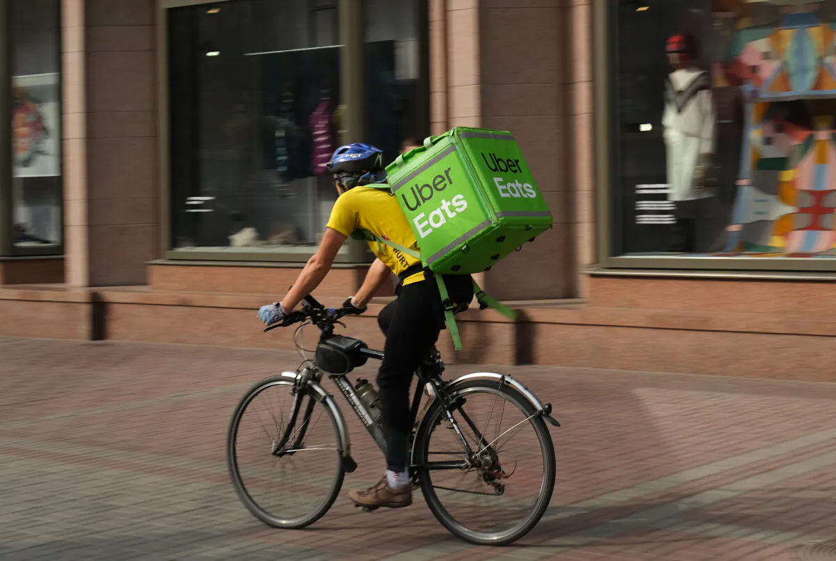 An Uber Eats food courier rides in the city center on Oct. 3, 2019 in Kiev, Ukraine. Uber has established itself firmly in Kiev and is now facing local competitors. (Sean Gallup/Getty Images)