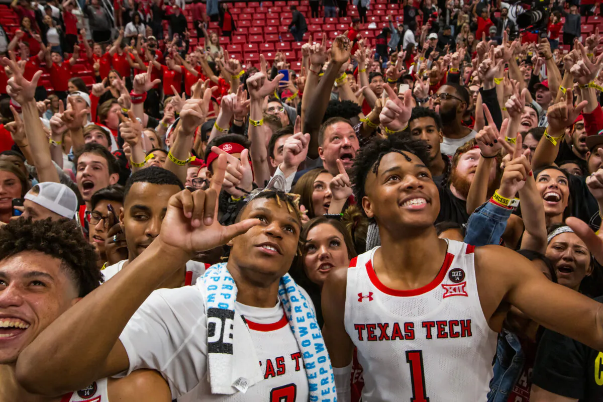 Members of the Texas Tech Red Raiders including guards Jahmi'us Ramsey #3 and Terrence Shannon #1, along with head coach Chris Beard, celebrate with fans after the college basketball game against the Eastern Illinois Panthers at United Supermarkets Arena on November 05, 2019 in Lubbock, Texas. John E. Moore III/Getty Images
