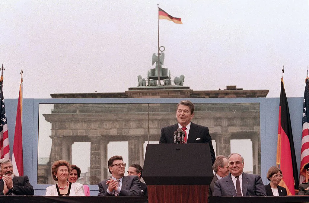 President Ronald Reagan addresses the people of West Berlin at the base of the Brandenburg Gate on June 12, 1987. The President's words could also be heard on the eastern side of the wall. "Tear down this wall!" he said to Soviet leader Mikhail Gorbachev. His address that day is considered by many to have affirmed the beginning of the end of the Cold War and the fall of communism. (Mike Sargent/AFP via Getty Images)