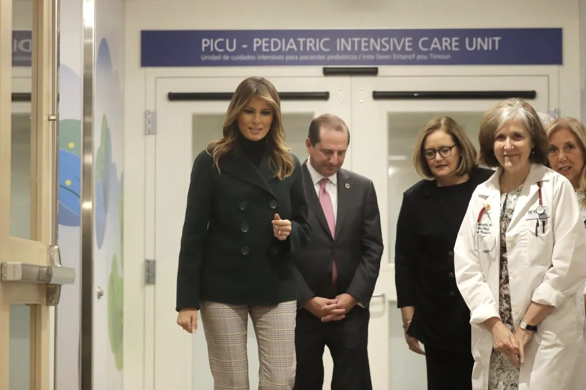 First Lady Melania Trump (L) walks with pediatrician Eileen Costello, front right, and Secretary of Health and Human Services Alex Azar, behind center left, during a visit to Boston Medical Center, in Boston, on Nov. 6, 2019. (Steven Senne/AP Photo)
