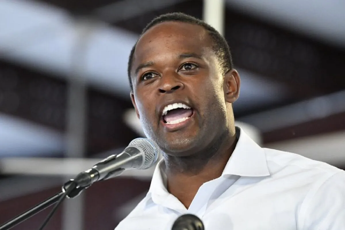 FILE - In this Aug. 3, 2019, file photo, Kentucky republican candidate for Attorney General Daniel Cameron, addresses the audience gathered at the Fancy Farm Picnic in Fancy Farm, Ky. Cameron was elected Nov. 5, 2019,l as Kentucky attorney general, first African American to win the office. (Timothy D. Easley, File/AP Photo)