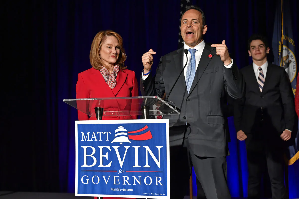 Kentucky Gov. Matt Bevin, right, and his wife, Glenna, speak to supporters gathered at a Republican Party event in Louisville, Ky. on Nov. 5, 2019. (Timothy D. Easley/AP Photo)