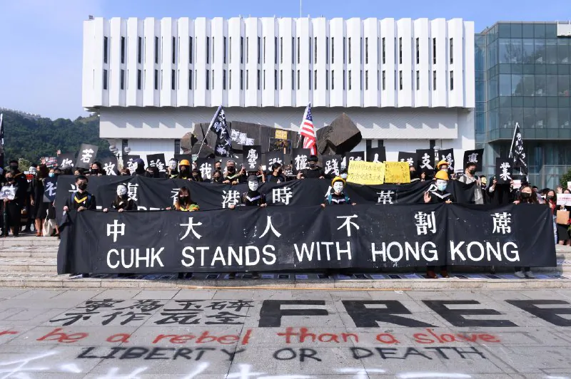 Graduates wearing masks hold an anti-government rally after their graduation ceremony at the Chinese University of Hong Kong in Hong Kong, China on Nov. 7, 2019. (Sung Pi Lung/The Epoch Times)