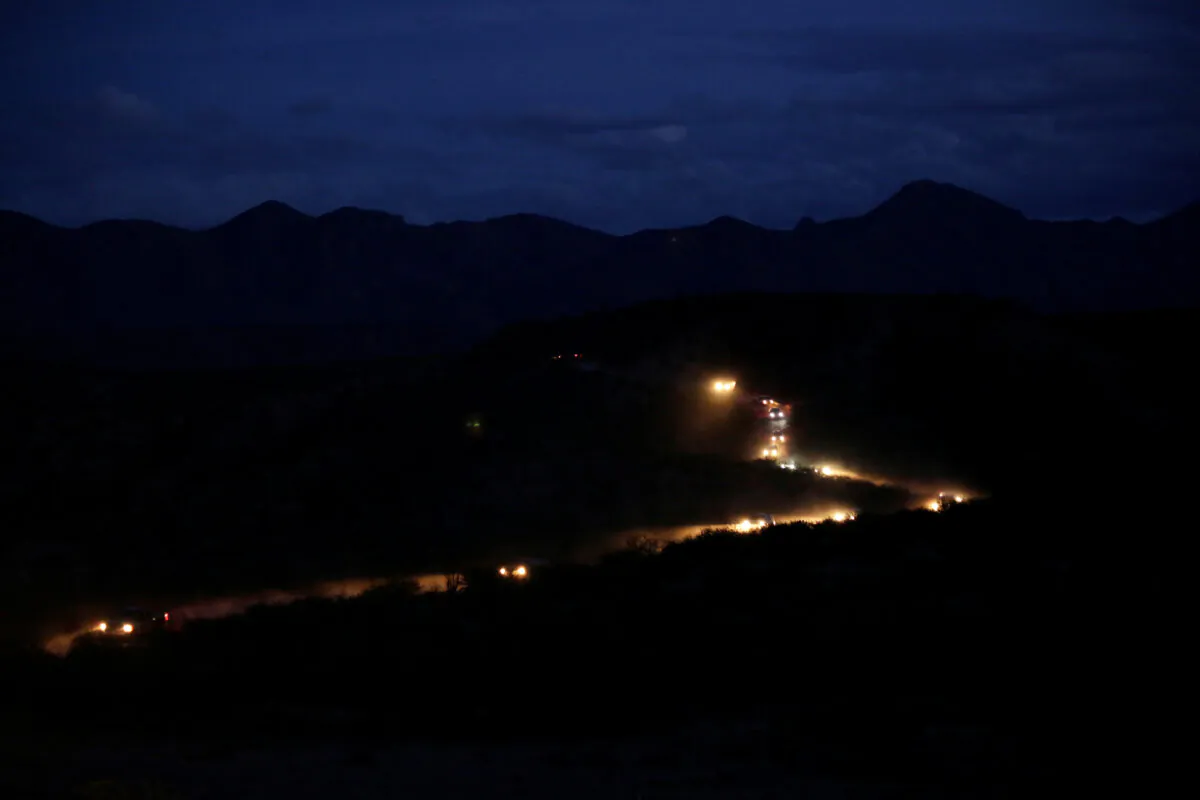 A caravan of vehicles with relatives and friends arrive for the funerals of slain members of the Mexican-American Mormon families, in Bavispe, Sonora state, Mexico, on Nov. 6, 2019. (Reuters/Jose Luis Gonzalez)