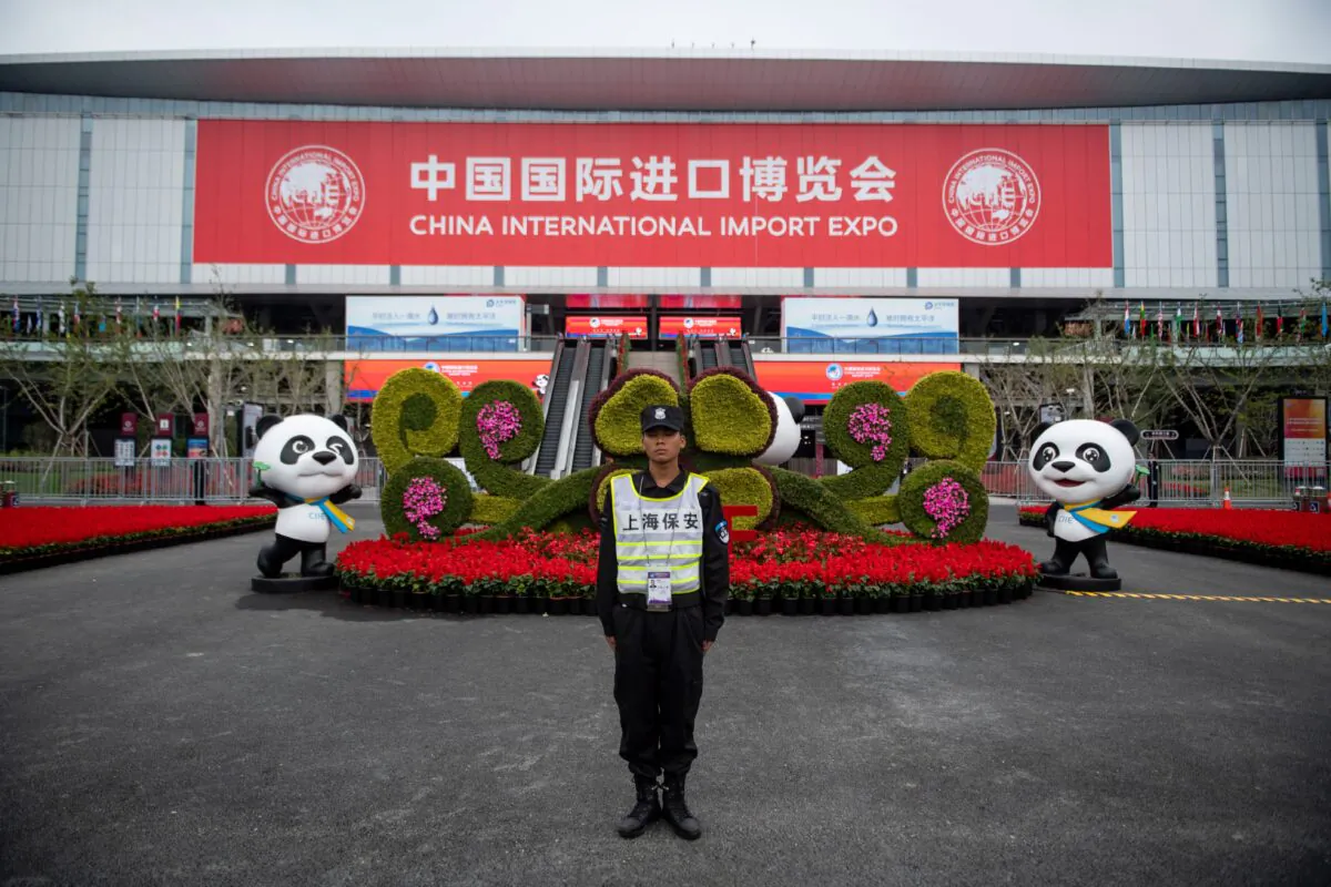 A security guard stands at the entrance to the first China International Import Expo (CIIE) in Shanghai on Nov. 5, 2019. Chinese leader Xi Jinping vowed on Nov. 5 to open access to China's economy, while delivering a veiled rebuke to the Trump administration, as he kicked off an import fair amid growing foreign accusations that his government was backtracking on reform pledges. (Johannes Eisele/AFP via Getty Images)