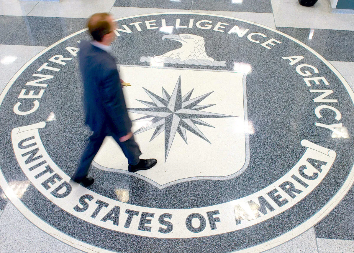 A man crosses the Central Intelligence Agency (CIA) logo in the lobby of CIA Headquarters in Langley, Va., on Aug. 14, 2008. (Saul Loeb/AFP via Getty Images)