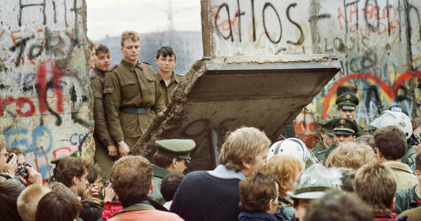 West Berliners crowd in front of the Berlin Wall